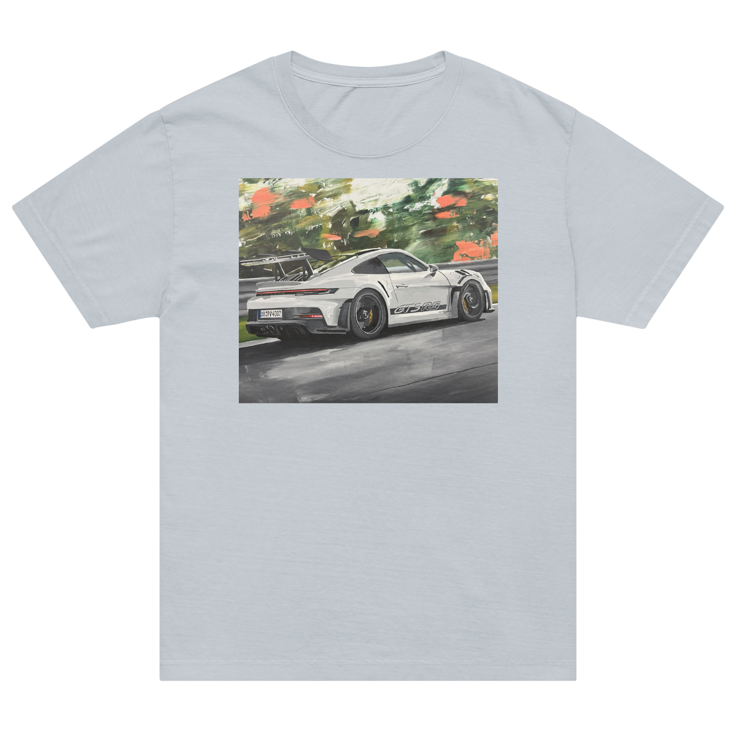 A light gray crewneck t-shirt featuring a rectangular graphic print of a white sports car on a racetrack with green foliage in the background. Daniel Maltzman artist.
