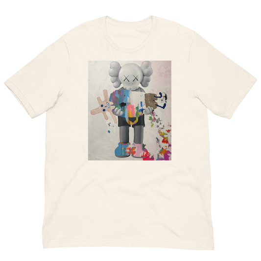 An off-white crewneck t-shirt featuring a central graphic print of a stylized cartoon character resembling KAWS, holding a pink and blue paintbrush and surrounded by colorful paint splatters. Daniel Maltzman artist.