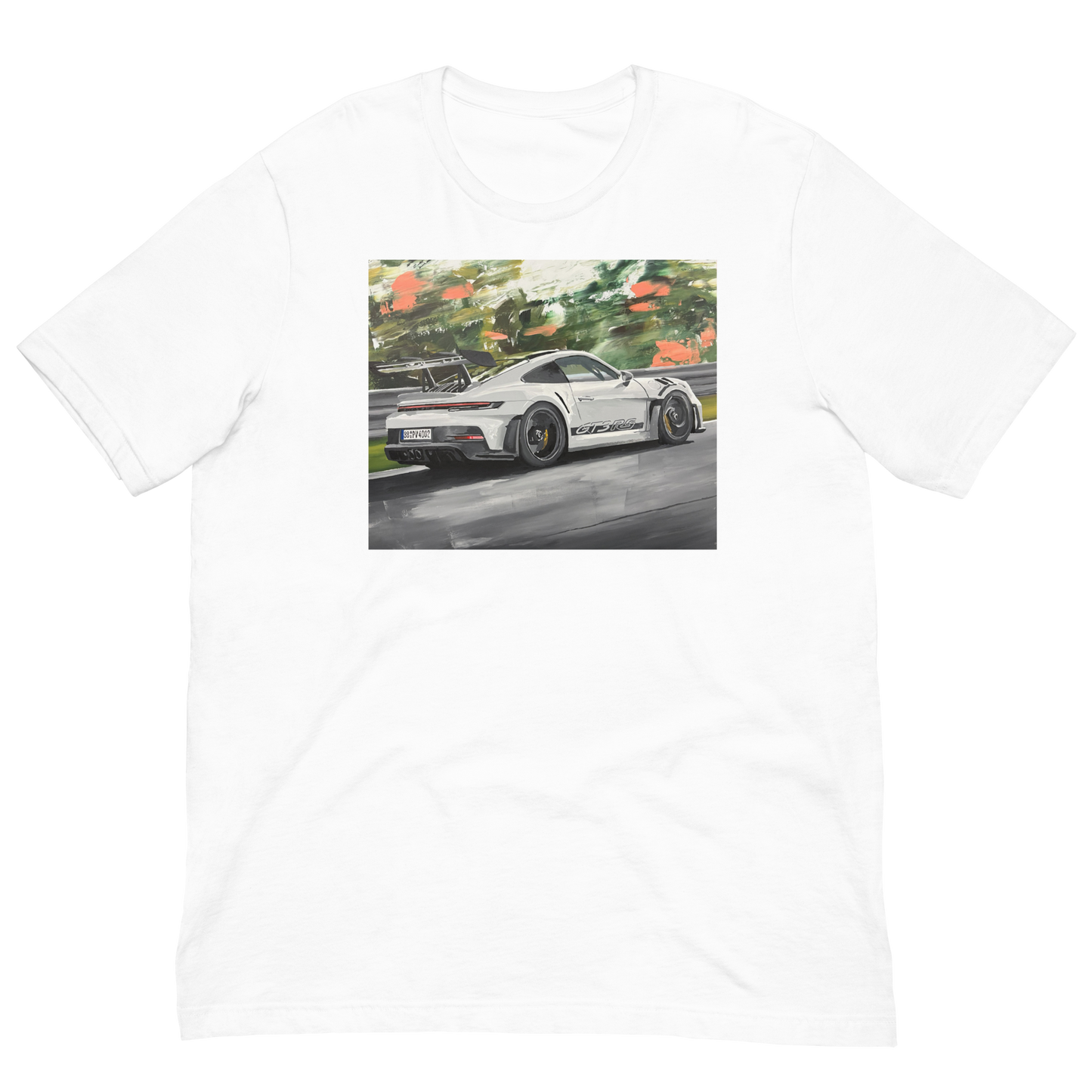 A white short-sleeve crewneck t-shirt featuring a rectangular graphic print of a white sports car on a wet racetrack with green foliage in the background. Daniel Maltzman original desgn.