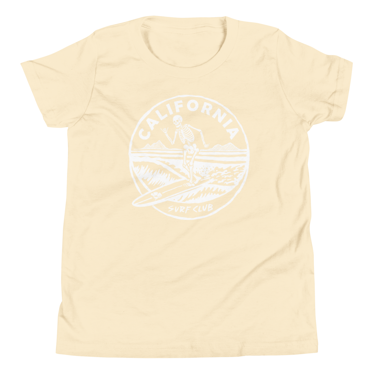 A pale cream-colored short-sleeve t-shirt with a white circular graphic on the chest featuring a skeleton surfer and the text 'CALIFORNIA SURF CLUB'.