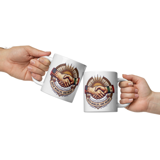 Two white ceramic mugs with a matching graphic of a handshake and the text 'BOTH WORLDS, ONE HEART' are held up by two hands against a white background.