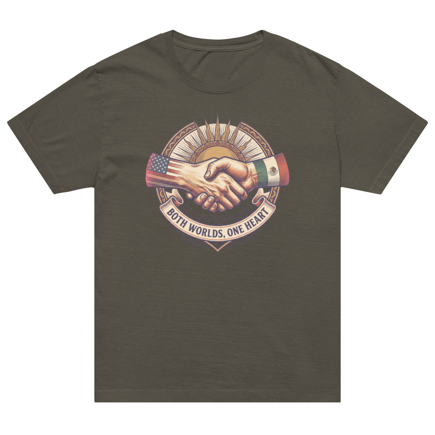 A dark olive green short-sleeve t-shirt with a central graphic of a handshake between a hand with an American flag and a hand with a Mexican flag, with the text 'BOTH WORLDS, ONE HEART' below.
