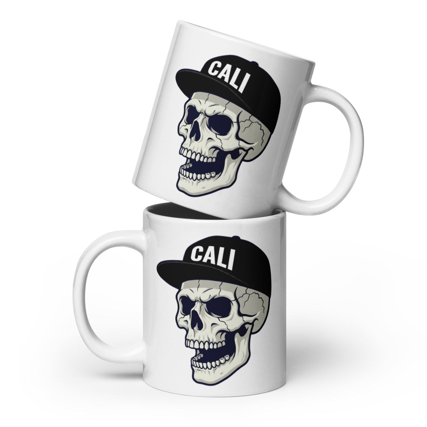Two stacked white ceramic mugs with a graphic of a skull wearing a black baseball cap that says 'CALI' in white letters, shown on a clean white background.