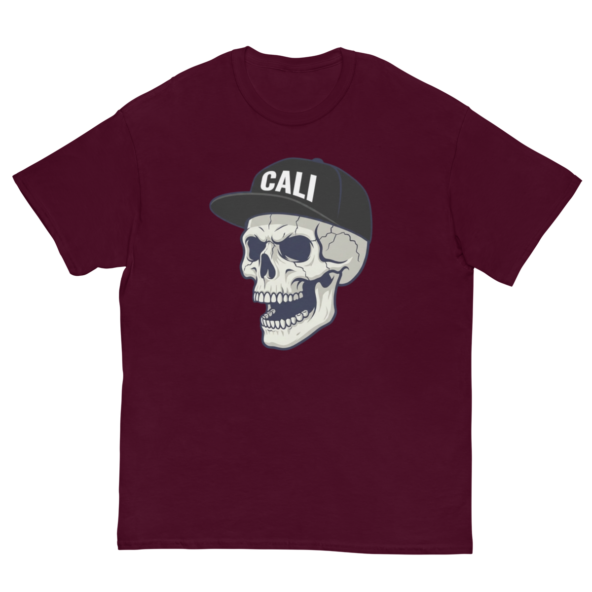 A maroon short-sleeve crewneck t-shirt featuring a graphic of a skull wearing a black baseball cap with 'CALI' printed in white on the front.