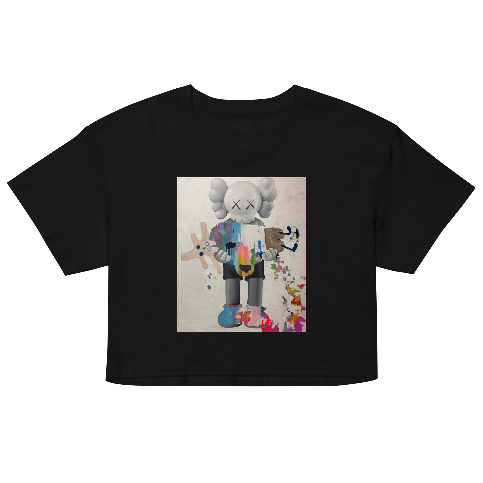 A black short-sleeve crop top t-shirt featuring a central graphic print of a stylized, multi-colored cartoon character resembling KAWS. Daniel Maltzman artist.