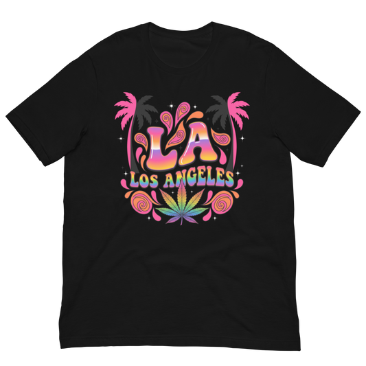 A black short-sleeve crewneck t-shirt featuring a colorful retro graphic on the chest with the text 'LA LOS ANGELES' in a rainbow gradient, flanked by pink palm trees and a green cannabis leaf motif.