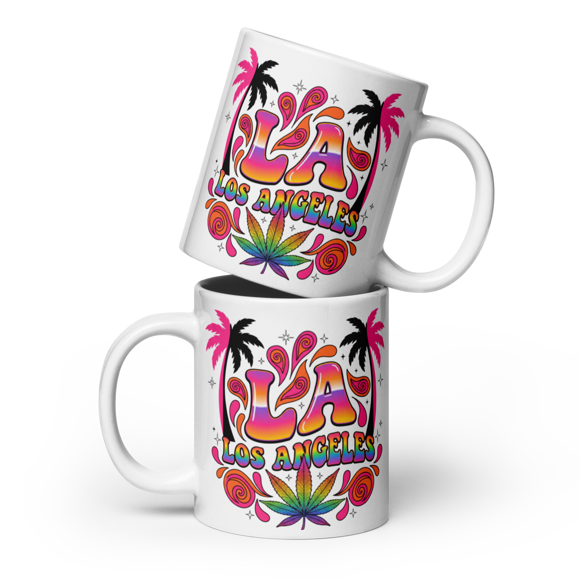Two white ceramic mugs stacked with a colorful 'LA Los Angeles' graphic featuring palm trees, psychedelic swirls, and a cannabis leaf design, on a white background.