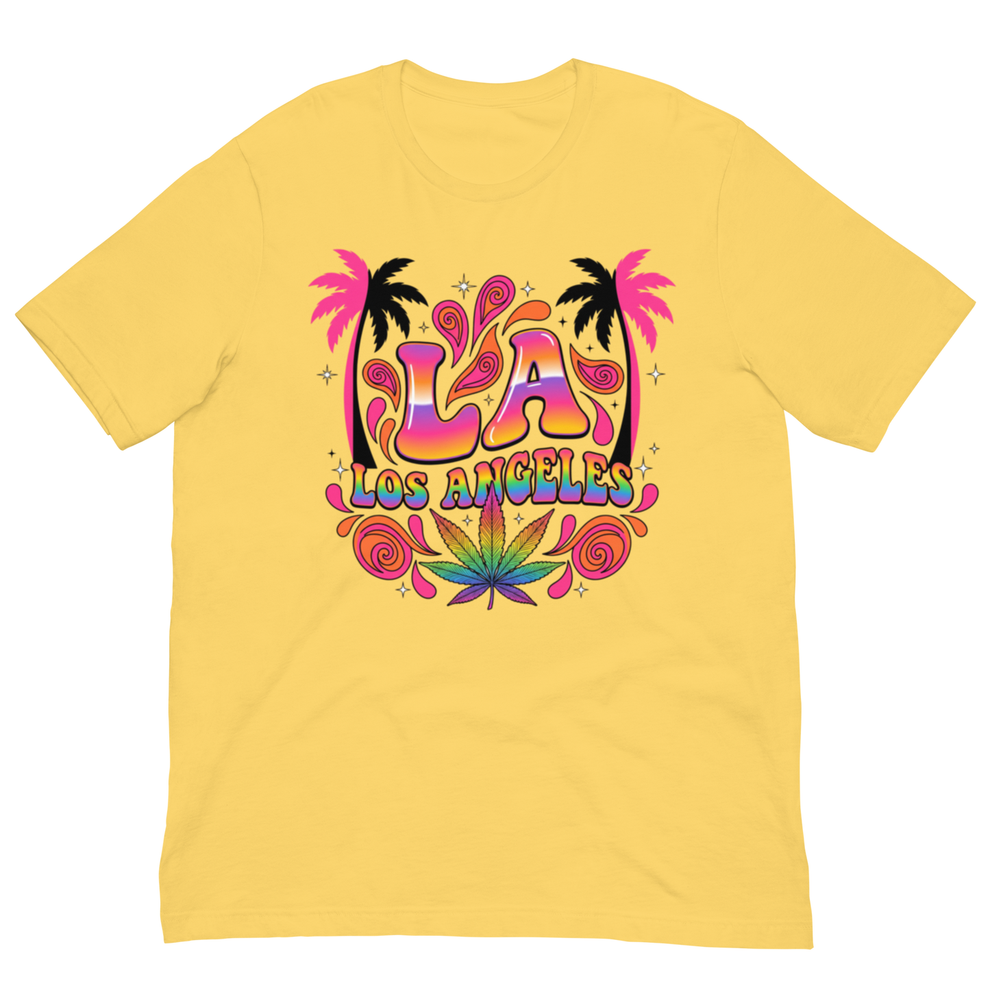 A yellow short-sleeve crewneck t-shirt featuring a colorful retro graphic on the chest with the text 'LA LOS ANGELES' in a rainbow gradient, flanked by pink palm trees and a green marijuana leaf at the bottom.
