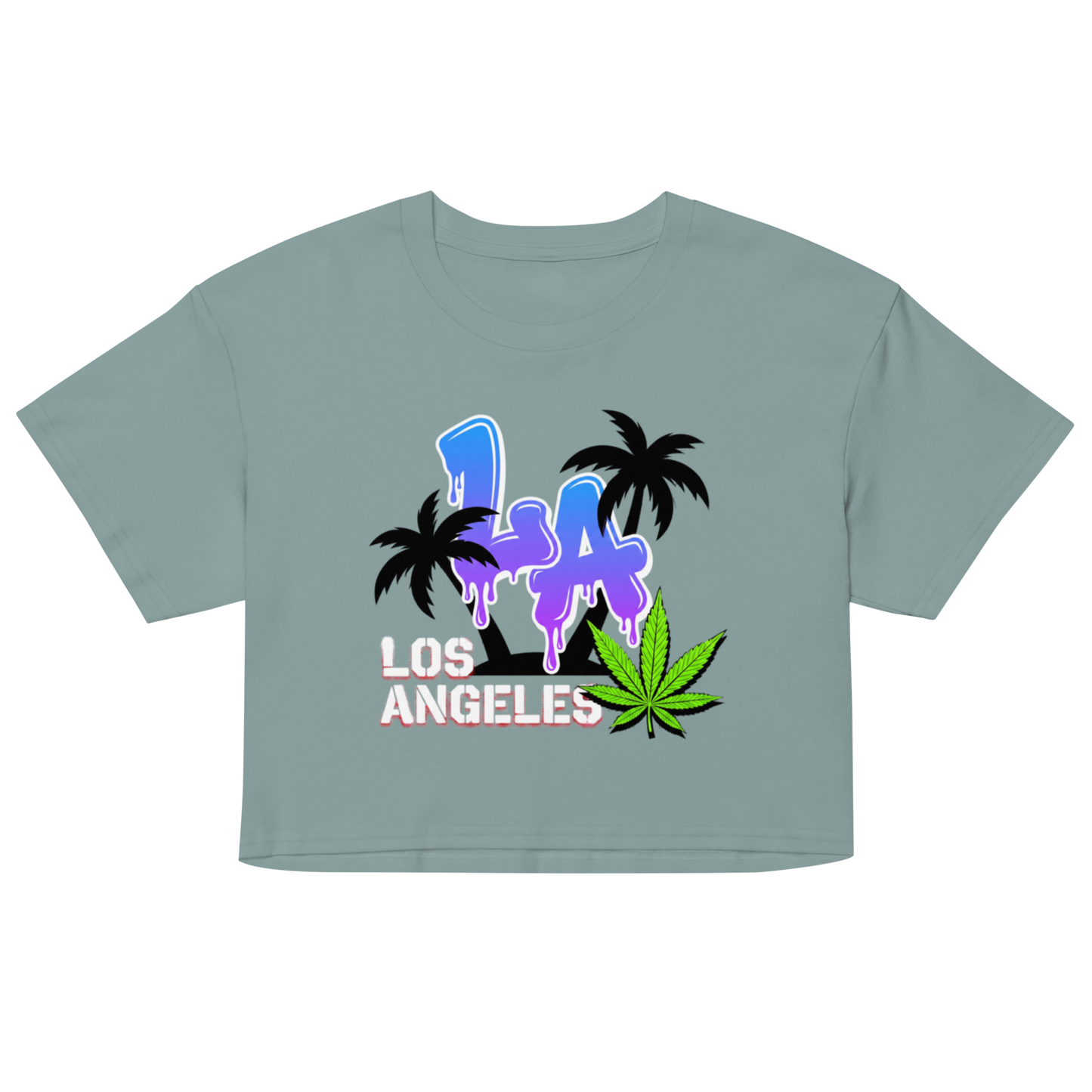 A cropped short-sleeve t-shirt in a muted sage green, featuring a colorful graphic on the front with the text 'LA LOS ANGELES' in blue and white, black palm trees, and a green cannabis leaf.