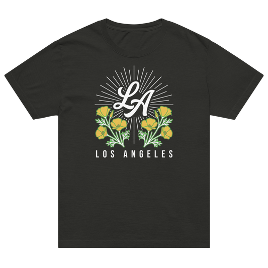 A black short-sleeve crewneck t-shirt featuring a Los Angeles graphic print on the front. The design includes a white 'LA' script inside a sunburst, flanked by yellow flowers with green leaves, and the text 'LOS ANGELES' printed below in white.