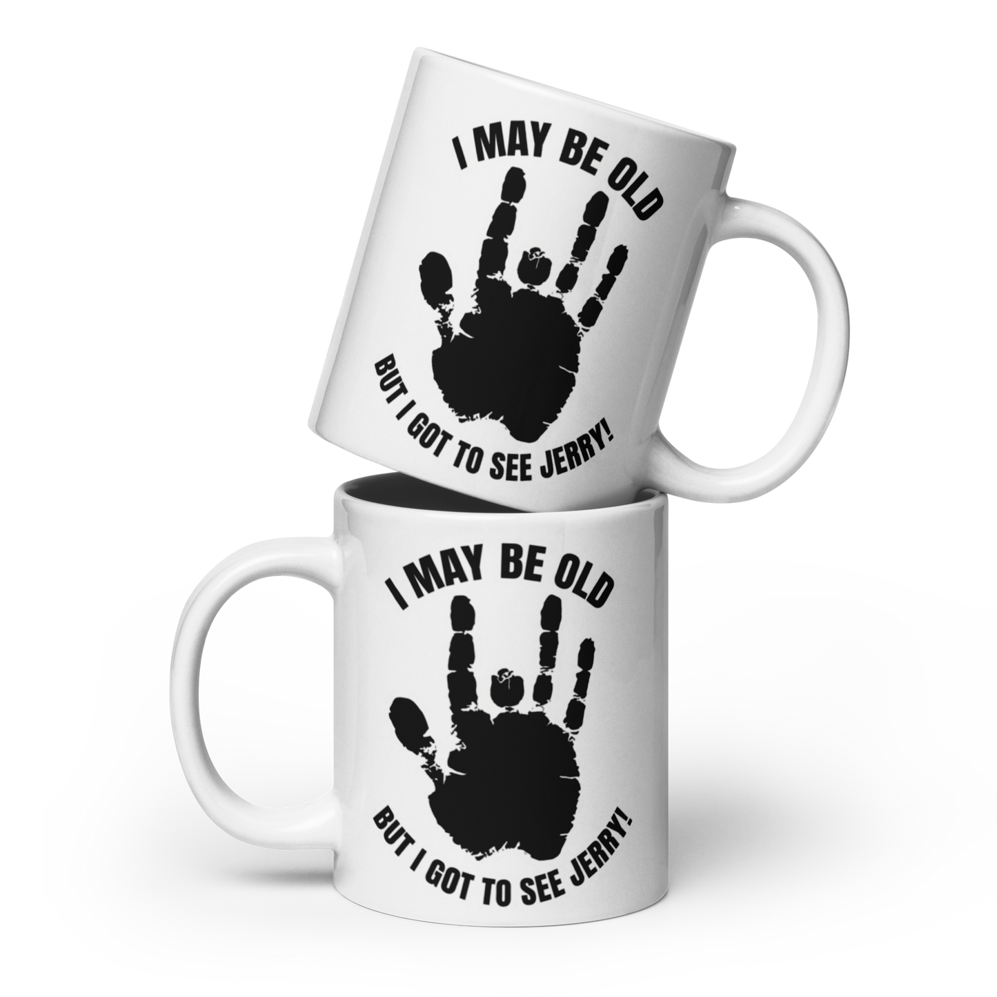 Two white ceramic mugs stacked with a black handprint graphic and the text 'I MAY BE OLD BUT I GOT TO SEE JERRY!' on a clean white background.