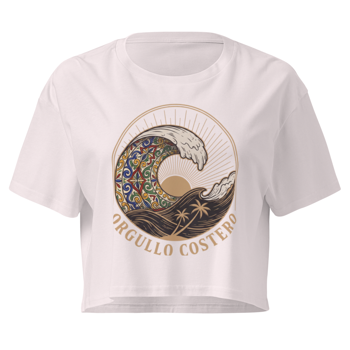 A white short-sleeve crop top t-shirt featuring a circular graphic print of a stylized wave with a mandala pattern, a sun, palm trees, and the text 'ORGULLO COSTERO' in gold-brown.
