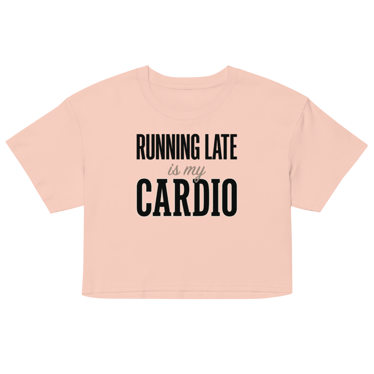 A light peach-pink short-sleeve crop top t-shirt with the text 'RUNNING LATE is my CARDIO' printed in black on the front.