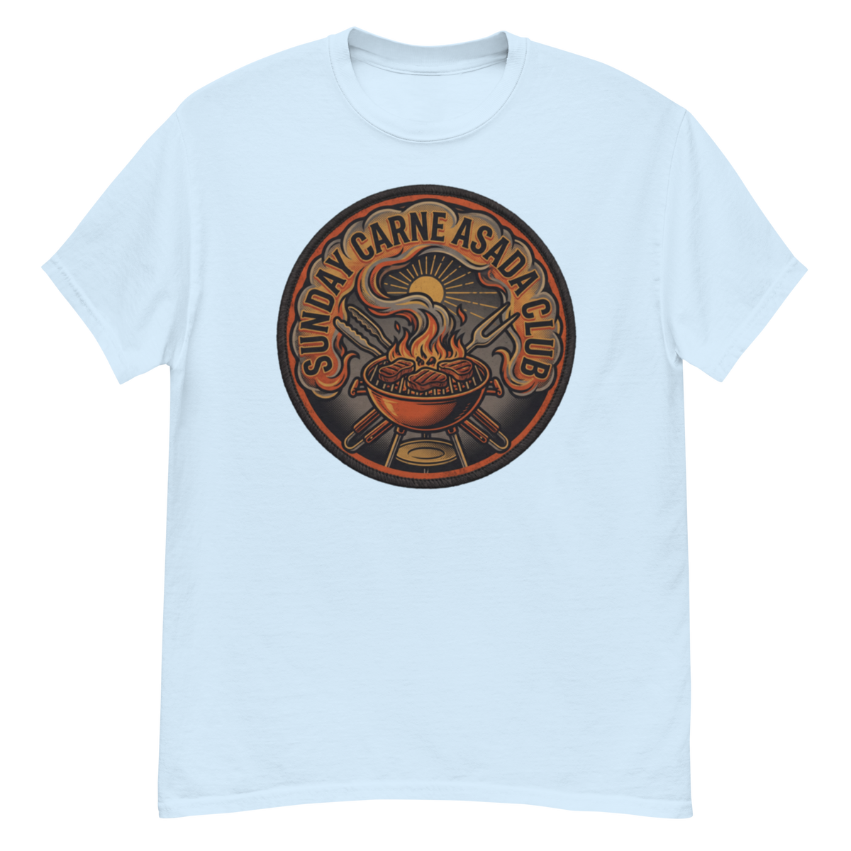 A light blue crewneck t-shirt featuring a circular graphic print on the chest with the text 'SUNDAY CARNE ASADA CLUB' surrounding a flaming grill and hot dog illustration.
