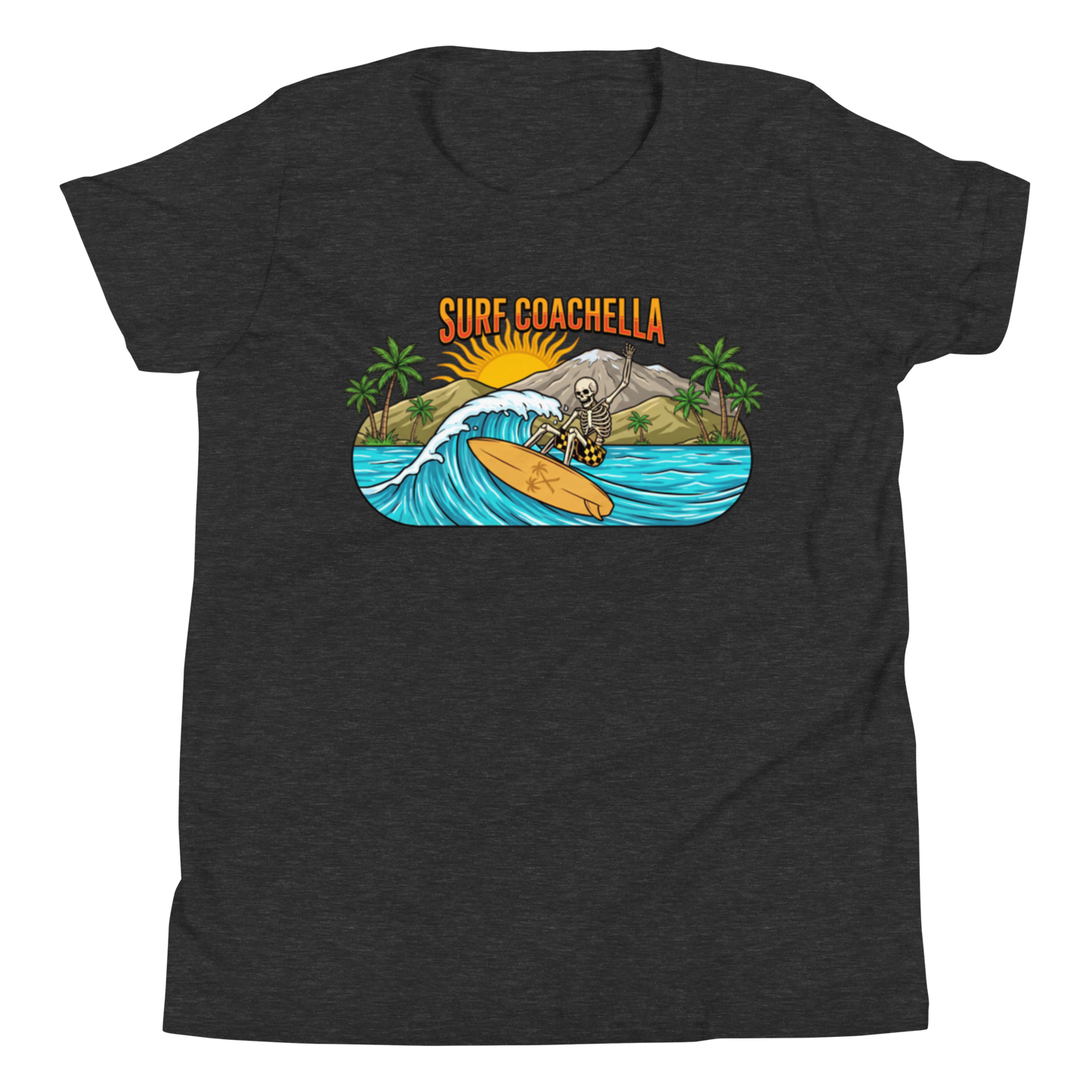 A dark heather gray short-sleeve t-shirt with a colorful graphic print on the chest. The graphic features the text 'SURF COACHELLA' in orange above an illustration of a surfer riding a wave with palm trees and a mountain.