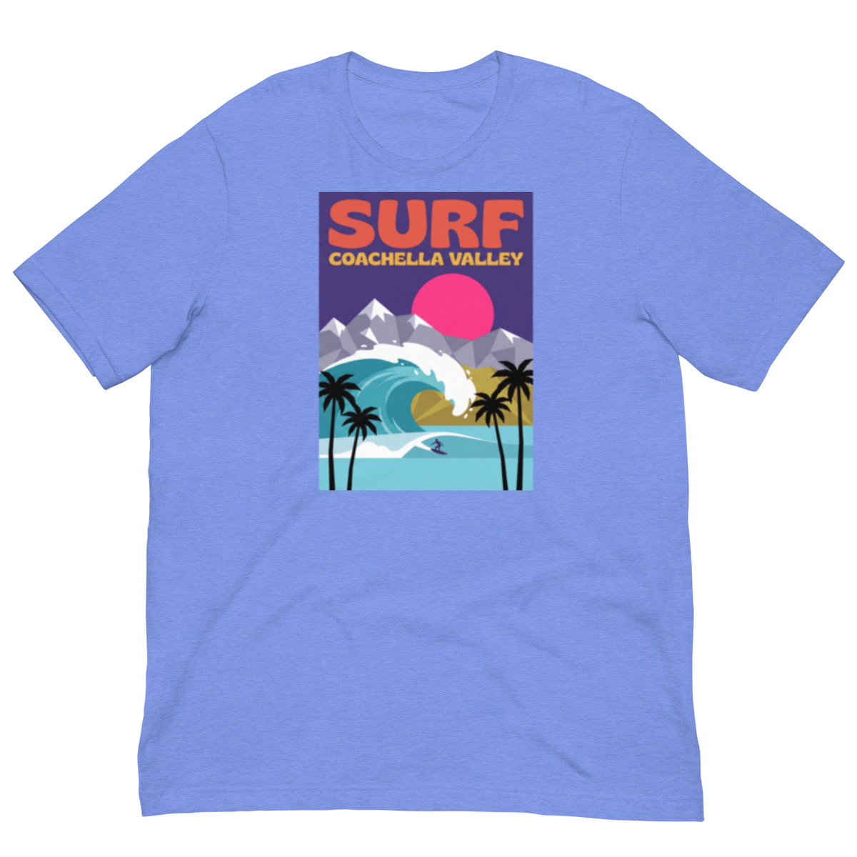 A light blue heathered short-sleeve t-shirt with a colorful graphic print on the chest. The graphic features the text 'SURF COACHELLA VALLEY' above an illustration of a surf wave, mountains, palm trees, and a pink sun.