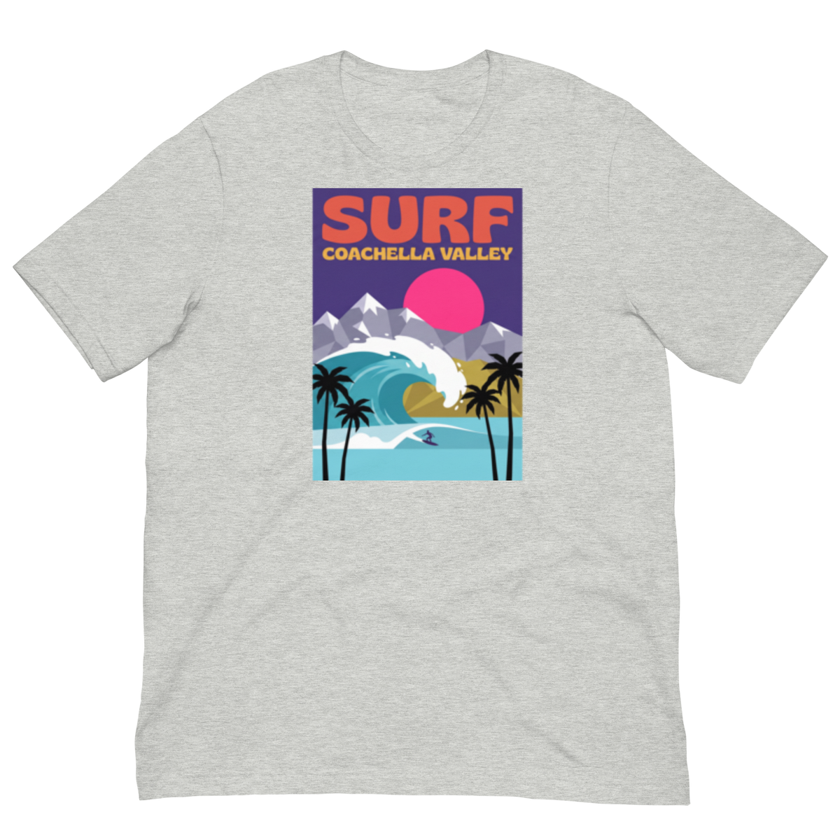A light heather gray short-sleeve crewneck t-shirt featuring a retro-style graphic print of a surfer in Coachella Valley, California. The graphic includes a pink sun, blue ocean wave, palm trees, mountains, and the text 'SURF COACHELLA VALLEY'.