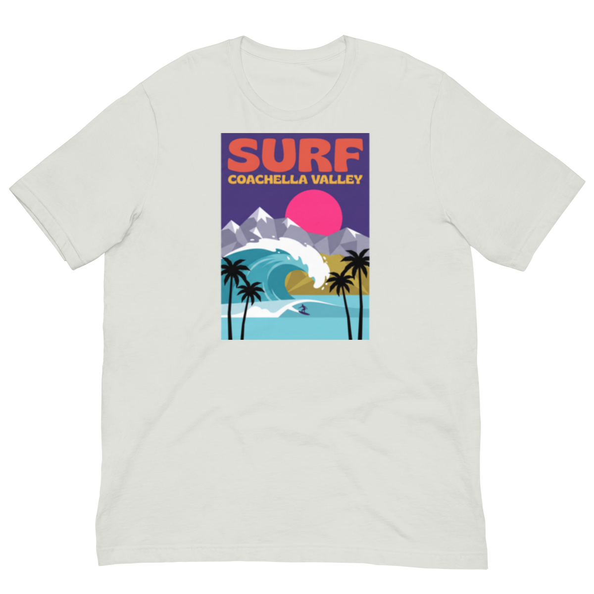 A light off-white crewneck t-shirt featuring a colorful retro-style graphic print of a surf scene in Coachella Valley, with a pink sun, blue wave, and palm trees.