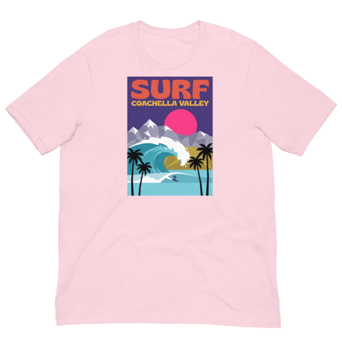 A light pink short-sleeve crewneck t-shirt featuring a retro-style graphic print of a surfer in Coachella Valley, with a pink sun, palm trees, and mountains.
