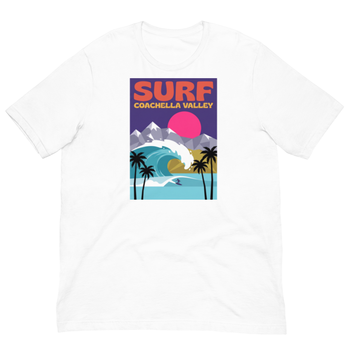 A white short-sleeve crewneck t-shirt featuring a colorful retro-style graphic print on the front with the text 'SURF COACHELLA VALLEY' and an illustration of a surfer, palm trees, mountains, and a pink sun.
