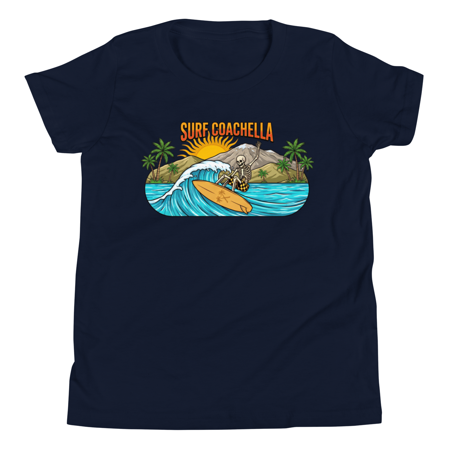 A navy blue short-sleeve crewneck t-shirt featuring a colorful graphic print on the chest. The graphic shows a skeleton surfing on an orange surfboard on a turquoise wave, with palm trees, a mountain, a rising sun, and the text 'SURF COACHELLA' in orange above.