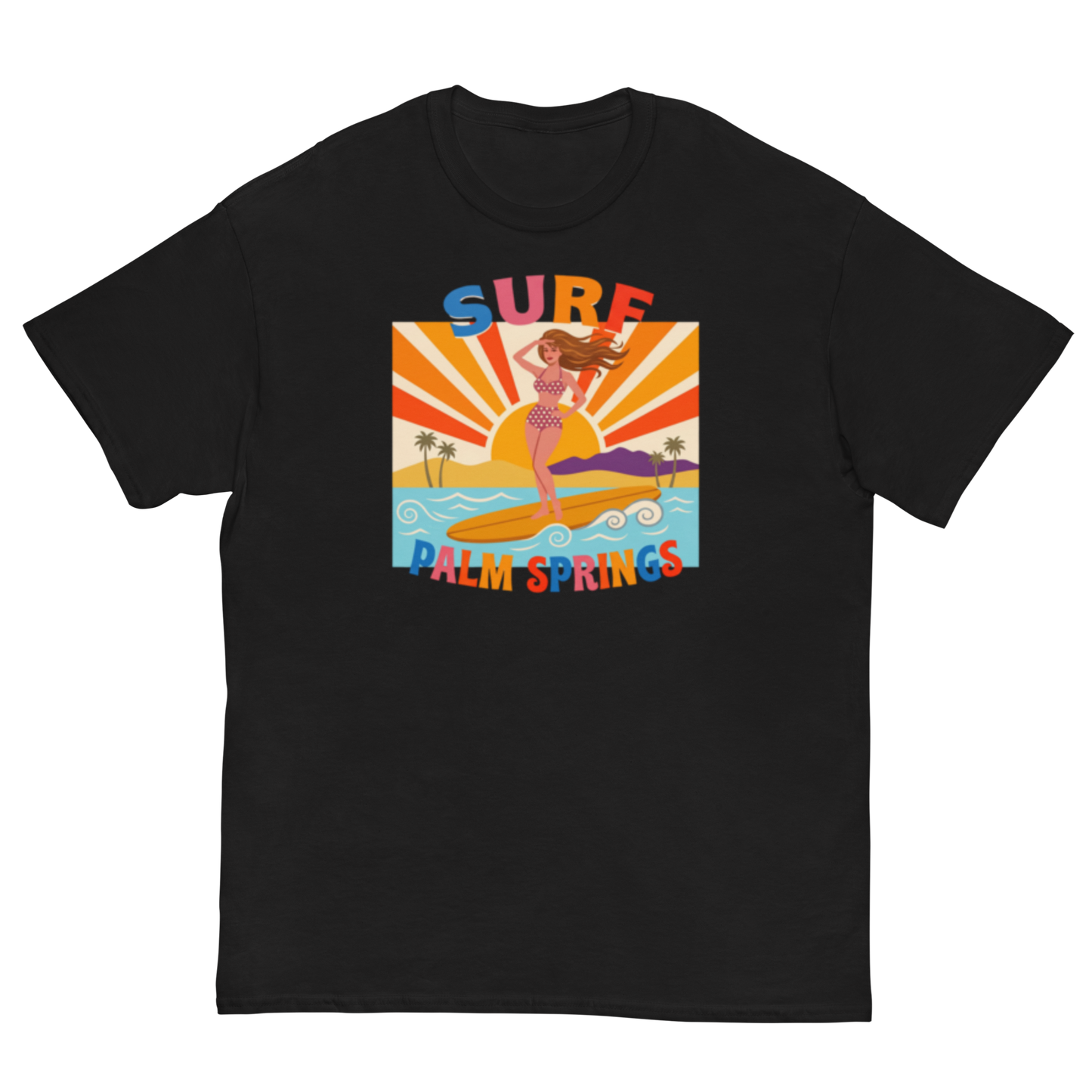 A black short-sleeve crewneck t-shirt featuring a retro-style graphic print of a woman surfing on a yellow board in Palm Springs, with 'SURF' and 'PALM SPRINGS' written in colorful retro lettering.