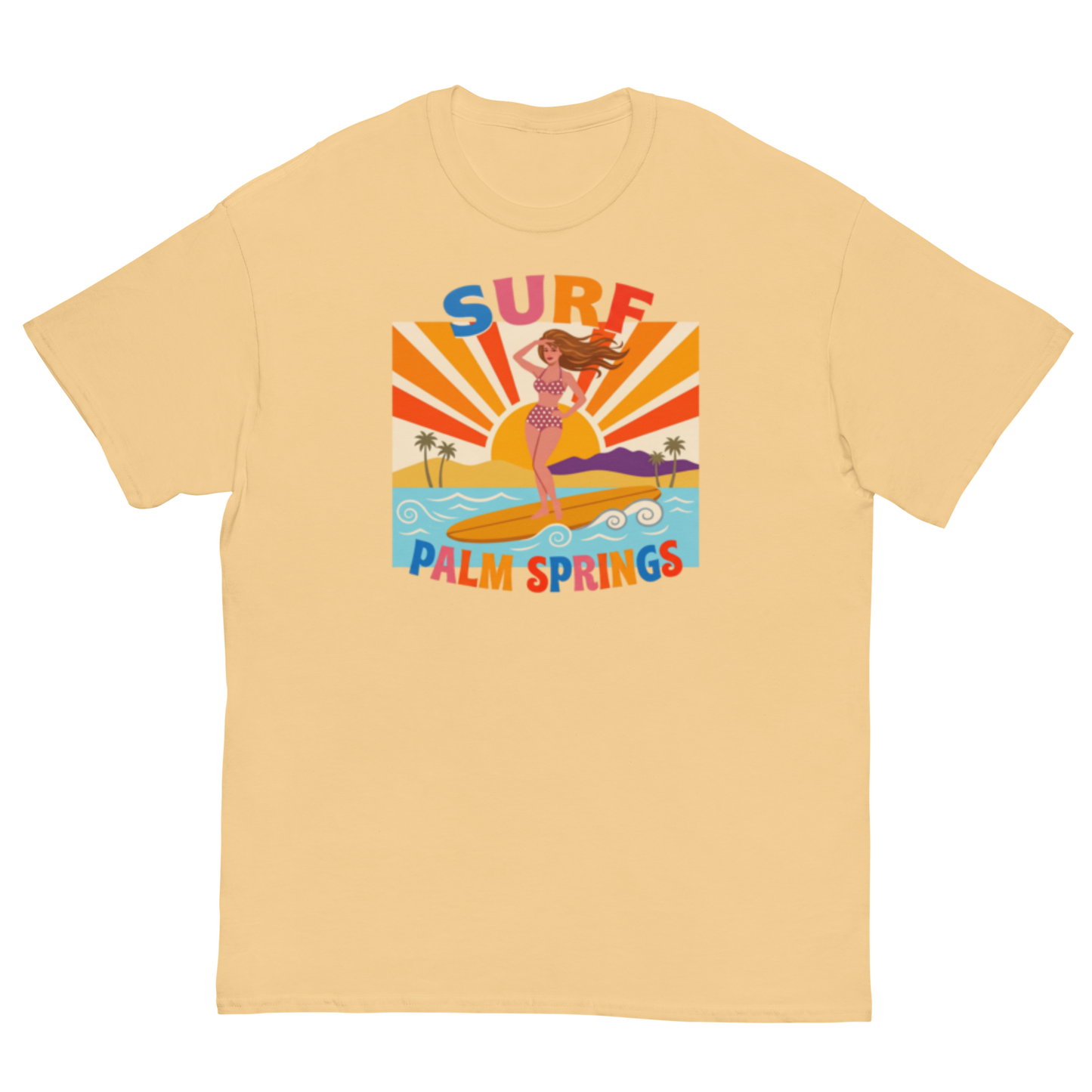A pale yellow-colored short-sleeve t-shirt with a retro-style graphic on the chest depicting a woman surfing on a yellow board with the text 'SURF PALM SPRINGS' in colorful letters.