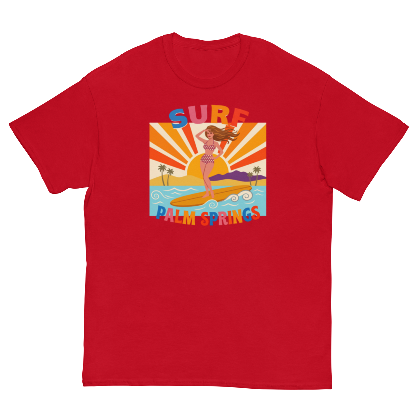 A red short-sleeve crewneck t-shirt featuring a colorful retro graphic of a woman surfing at Palm Springs with a sunset background.