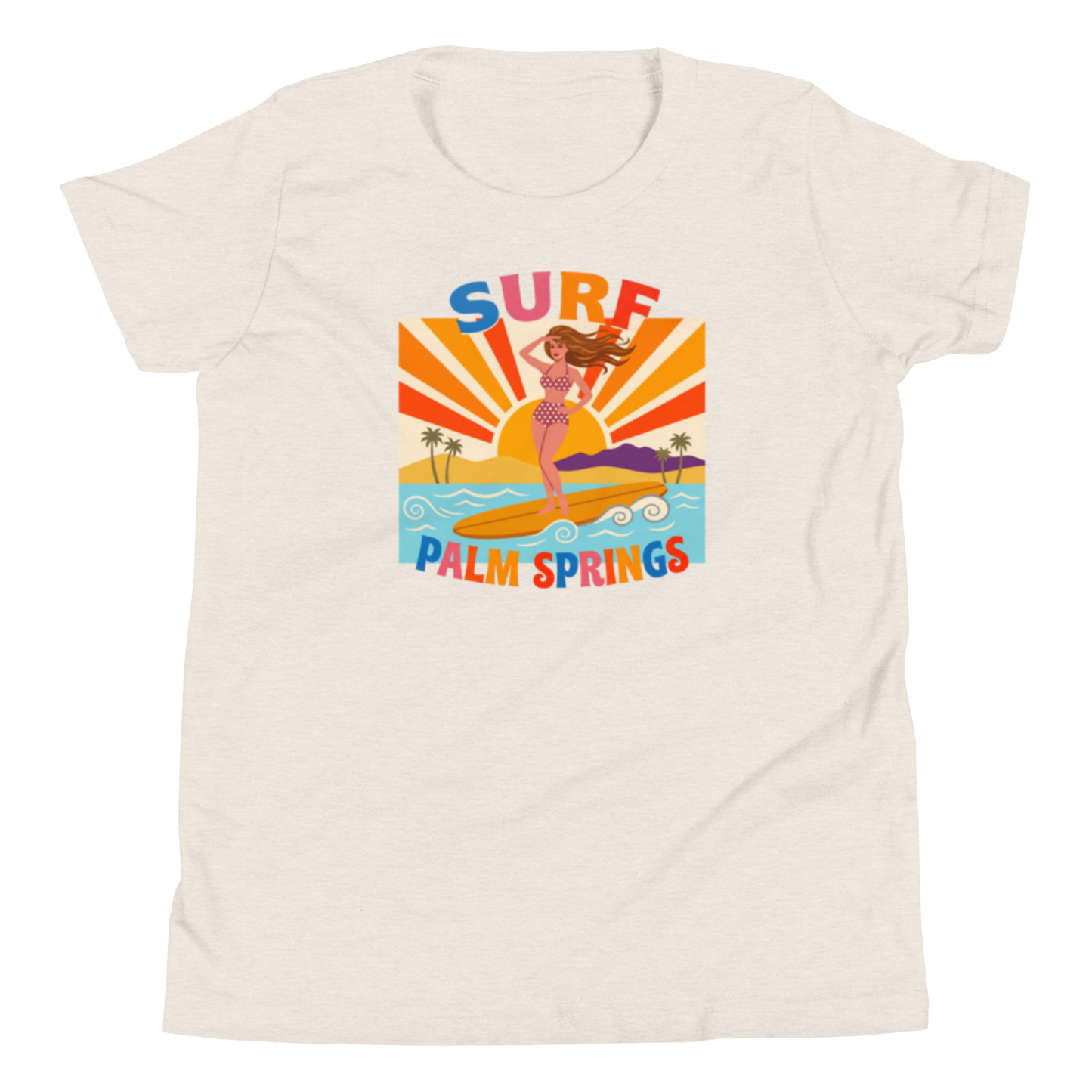 A women's short-sleeve crewneck t-shirt in a light heathered cream color, featuring a colorful retro graphic of a mermaid surfing with the text 'SURF PALM SPRINGS'.