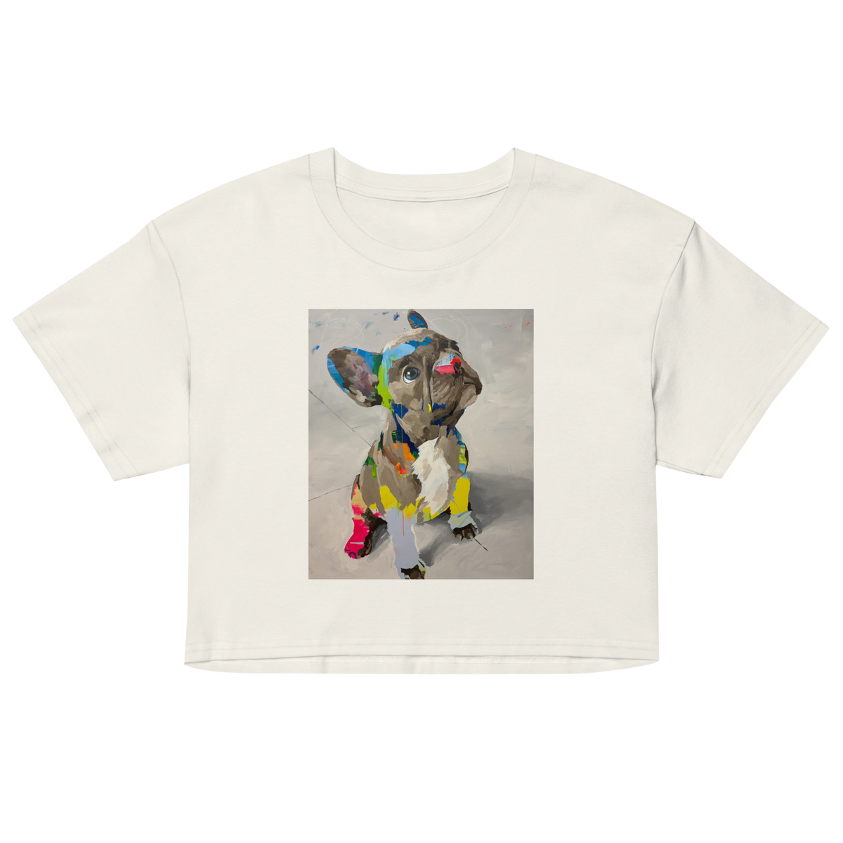 An ecru short-sleeve crop top t-shirt featuring a colorful graphic print of a French Bulldog on the front, displayed against a solid white background.