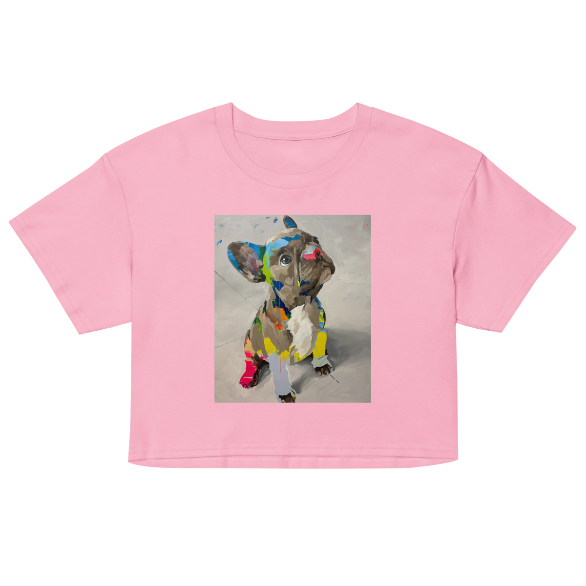 A light pink short-sleeve crop top t-shirt featuring a square graphic print of a French Bulldog painted in a colorful, artistic collage style, Daniel Maltzman artist. 