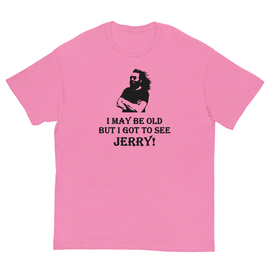 A pink short-sleeve crewneck t-shirt with a black graphic print of a bearded man and the text 'I MAY BE OLD BUT I GOT TO SEE JERRY!' on the front, displayed on a solid white background.