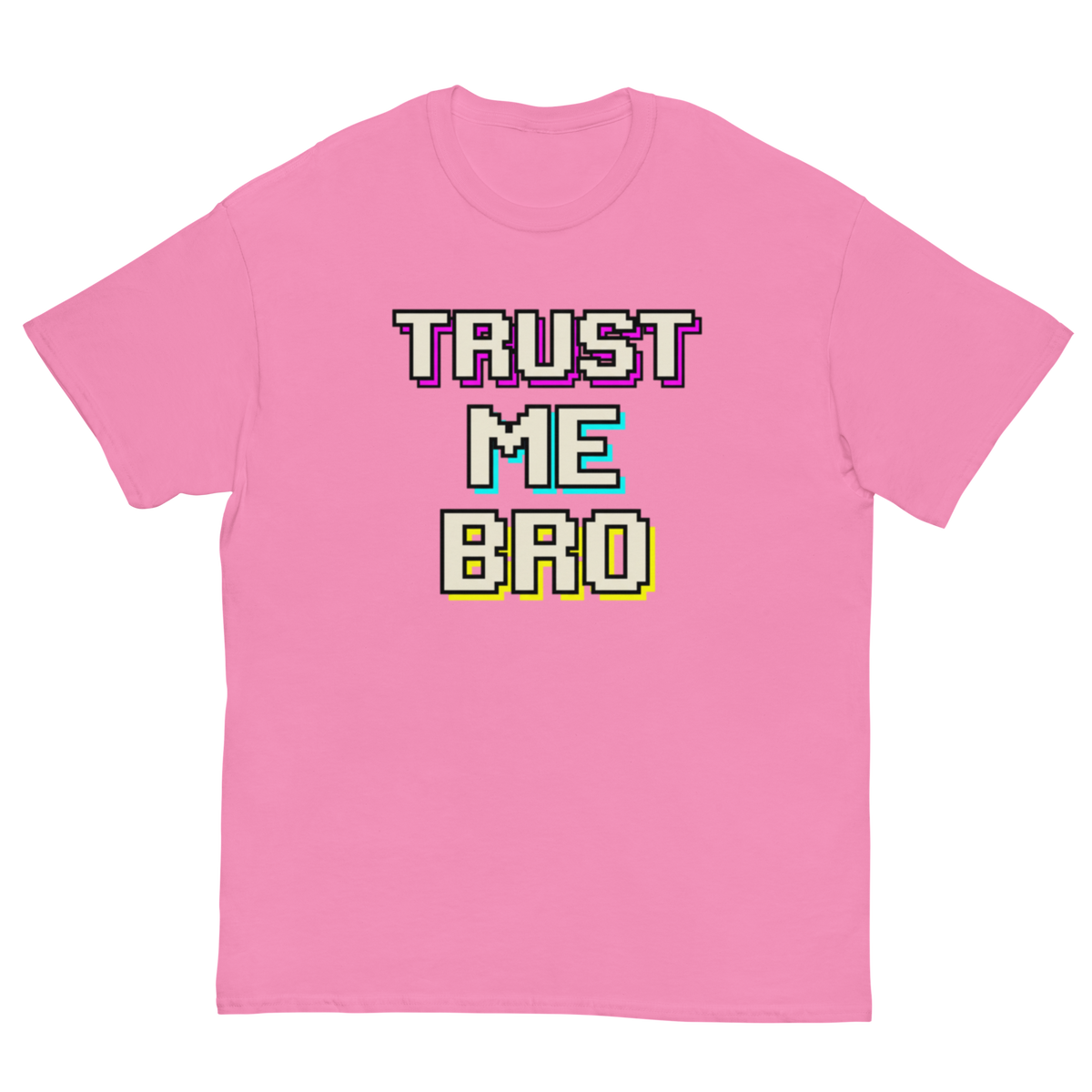 A pink short-sleeve crewneck t-shirt featuring a retro 8-bit pixelated graphic on the chest that reads 'TRUST ME BRO' in white, purple, teal, and yellow block letters.