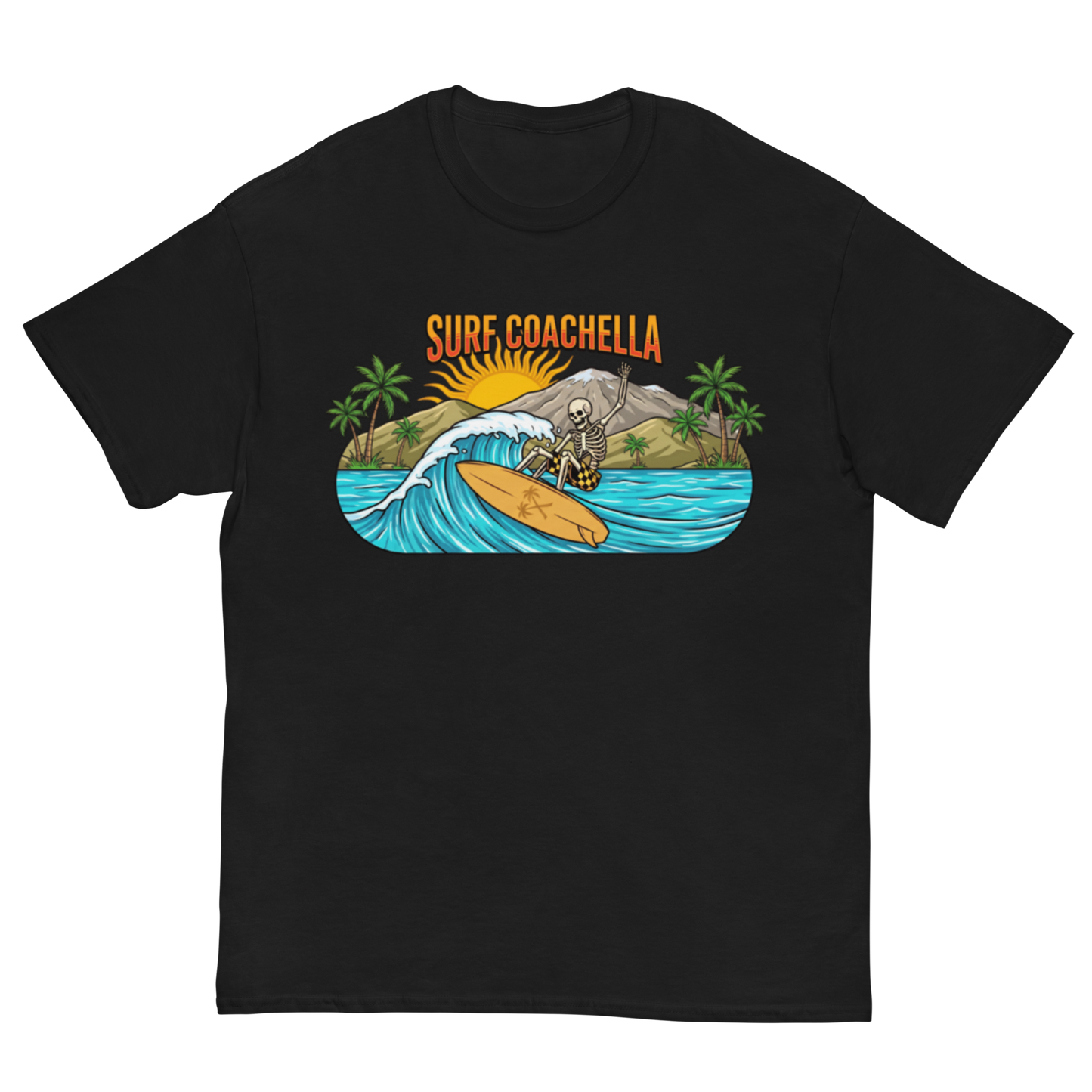 A black short-sleeve crewneck t-shirt featuring a colorful graphic print on the front. The graphic shows a skeleton surfer riding a wave on a yellow surfboard, with palm trees, a mountain, a yellow sun, and the text 'SURF COACHELLA' in orange above.