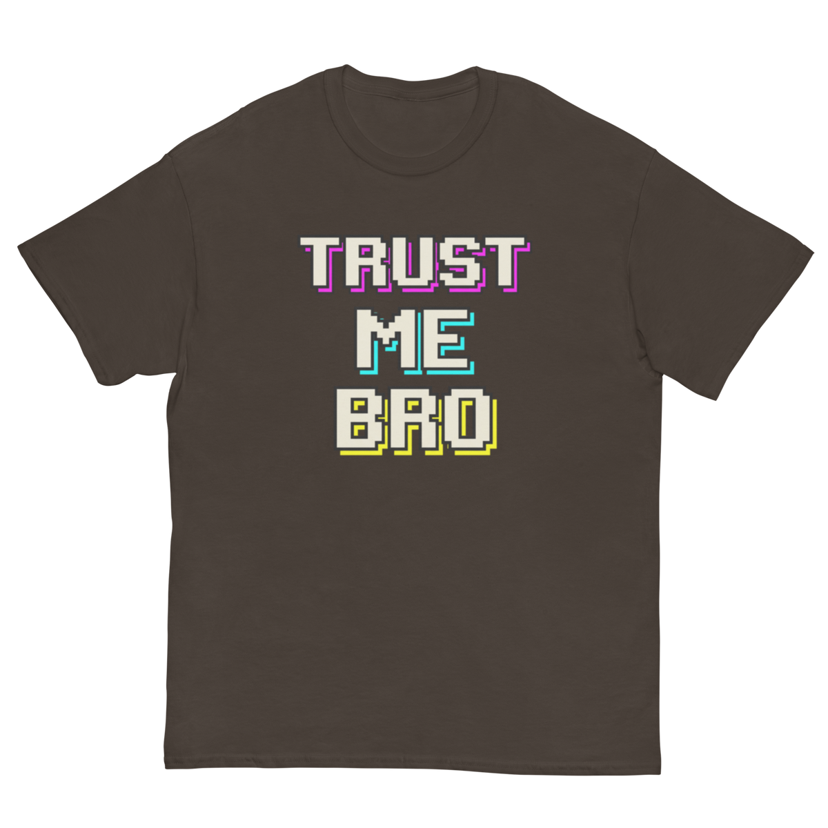 A dark brown short-sleeve t-shirt with a retro pixelated graphic on the chest that reads 'TRUST ME BRO' in white, purple, cyan, and yellow block letters, displayed on a solid white background.
