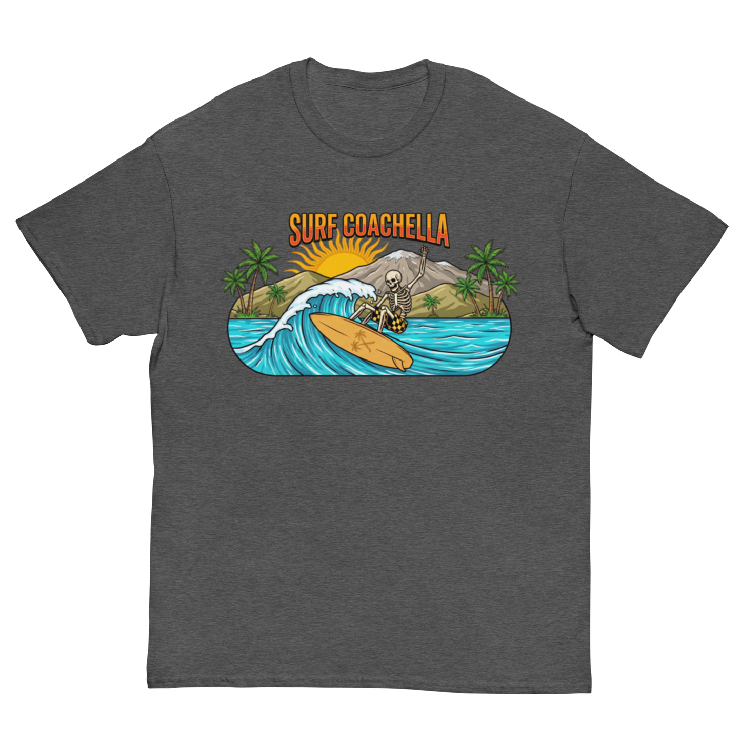 A dark heather gray crewneck t-shirt featuring a colorful graphic print of a skeleton surfer riding a wave on a yellow surfboard, with the text 'SURF COACHELLA' above it and palm trees in the background.