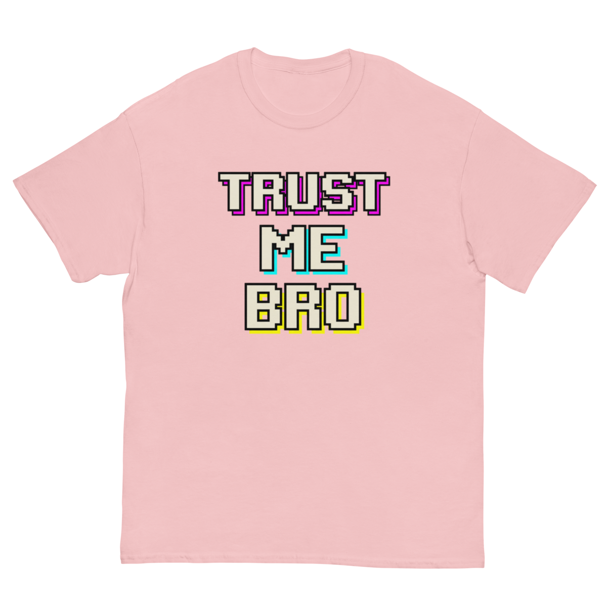 A light pink short-sleeve t-shirt with a retro pixelated graphic on the chest that reads 'TRUST ME BRO' in white, purple, teal, and yellow block letters, displayed on a solid white background.