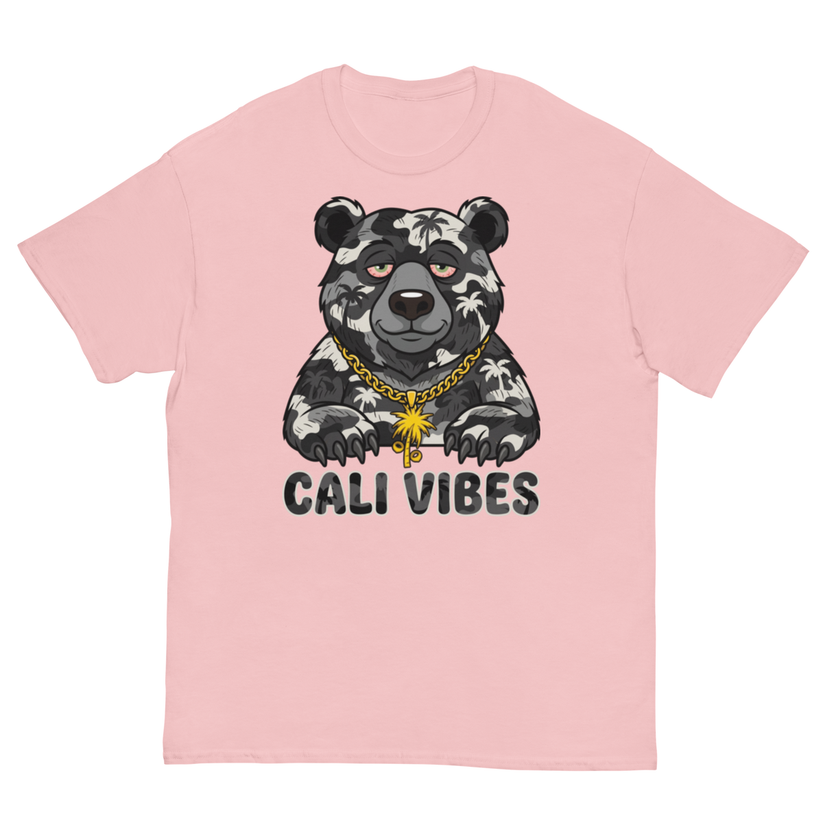 A light pink short-sleeve t-shirt with a graphic of a black and white patterned bear wearing a gold chain necklace, above the text 'CALI VIBES'.