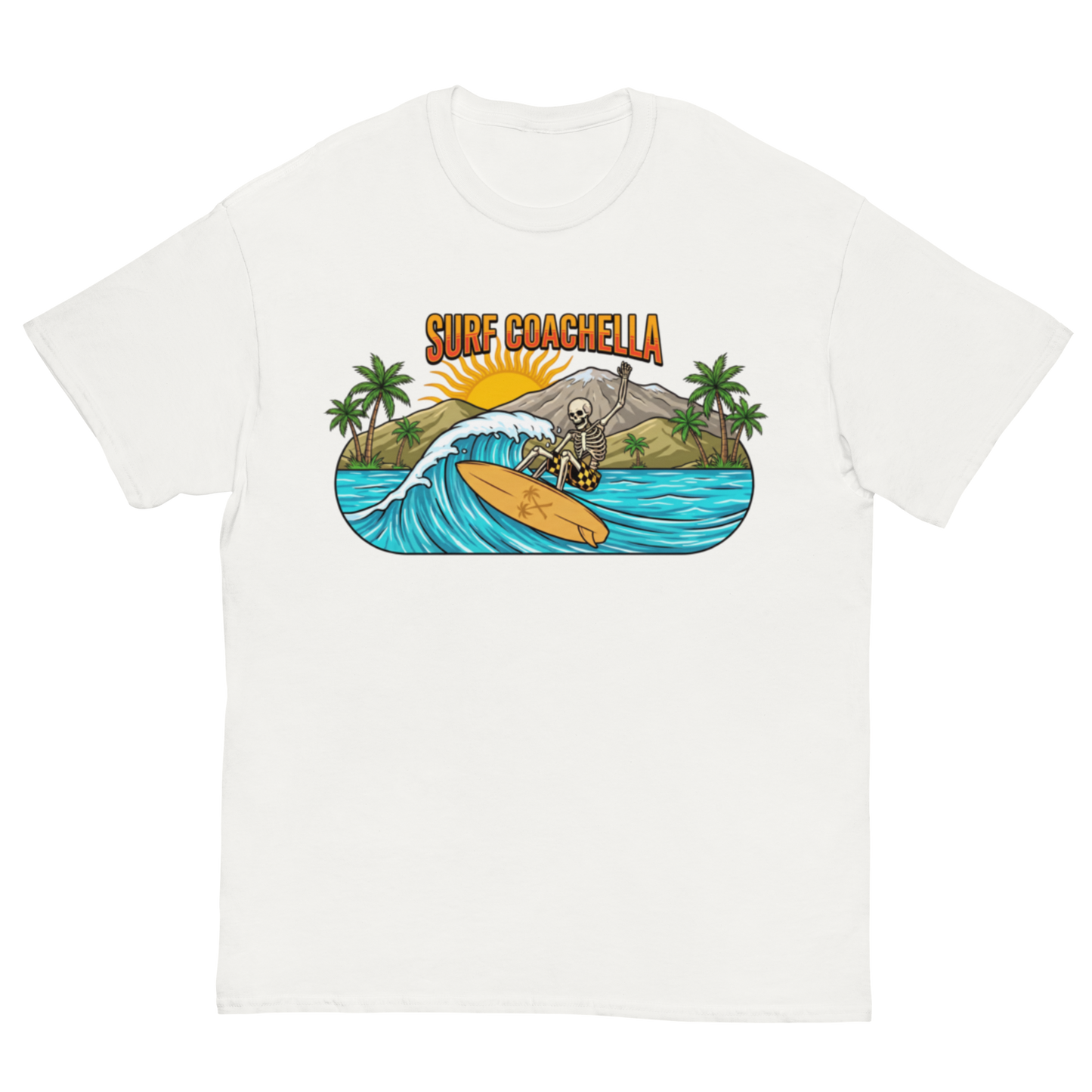 A white short-sleeve crewneck t-shirt featuring a colorful graphic print on the chest. The graphic depicts a skeleton surfer riding a wave on a yellow surfboard, with palm trees, a mountain, a rising sun, and the text 'SURF COACHELLA' in orange above.