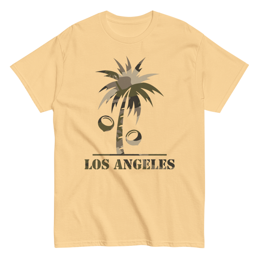 A pale yellow short-sleeve crewneck t-shirt featuring a graphic of a palm tree with coconuts and the text 'LOS ANGELES' printed below it.