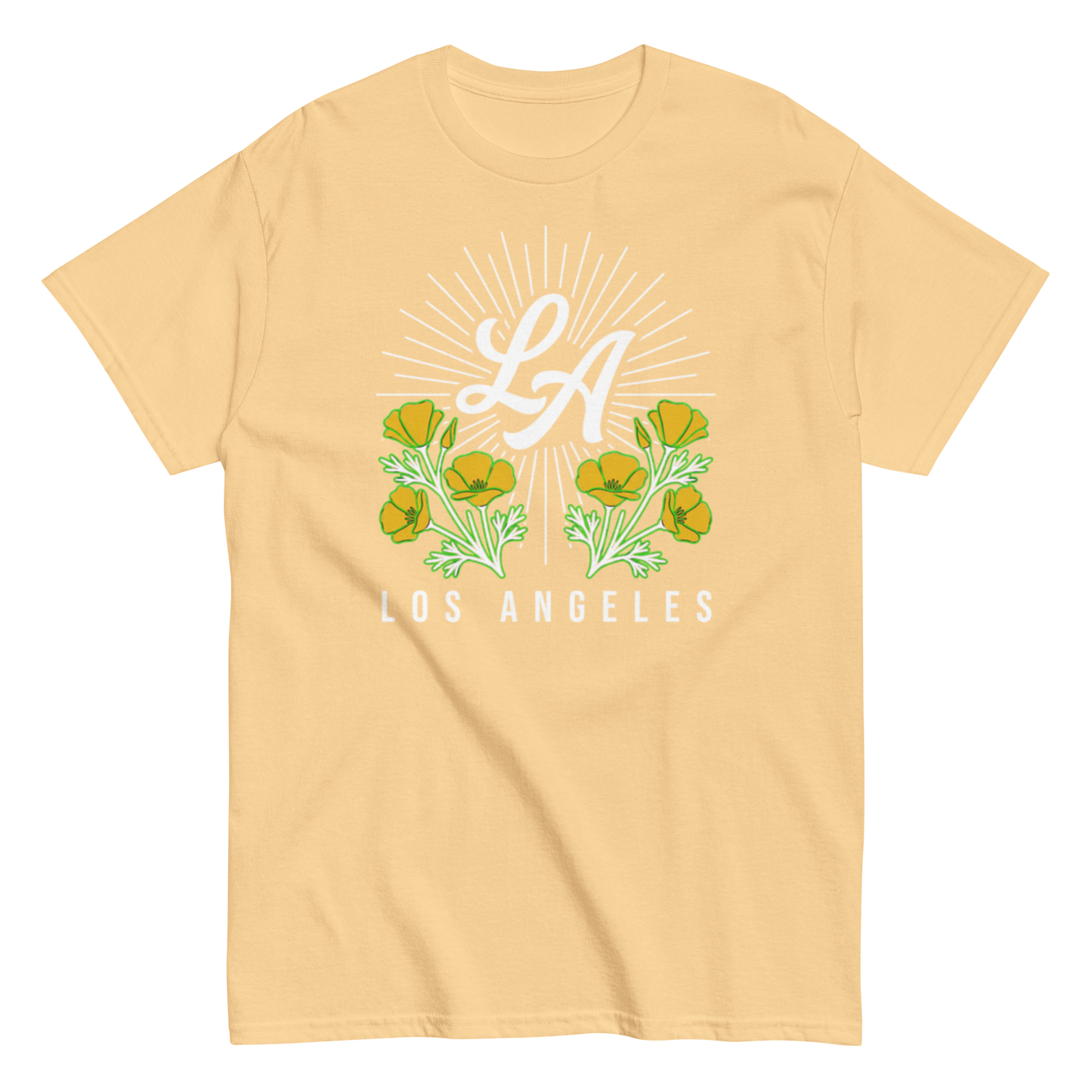 A light peach-colored short-sleeve t-shirt with a graphic on the chest featuring the letters 'LA' in white script under a white sunburst, flanked by green and yellow flowers, with 'LOS ANGELES' printed in white below.