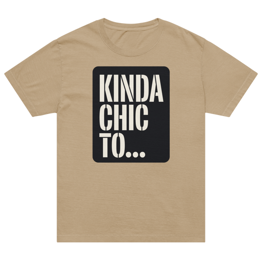 A tan crewneck t-shirt with a black rectangular graphic on the chest containing the text 'KINDA CHIC TO.