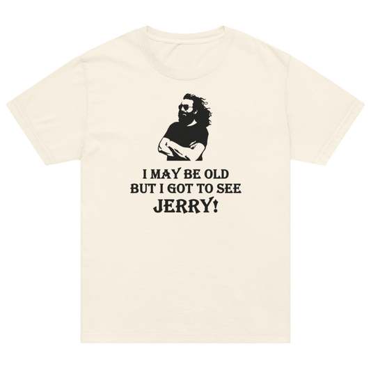 An off-white short-sleeve t-shirt with a black graphic of a bearded man wearing sunglasses and the text 'I MAY BE OLD BUT I GOT TO SEE JERRY!' printed on the front.