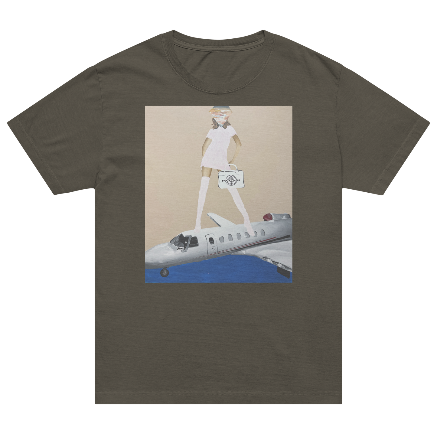 An olive green short-sleeve t-shirt with a rectangular graphic print on the chest. The graphic features an illustration of a woman in a white dress standing on top of a white private jet against a beige background with blue water below. Daniel Maltzman artist. 