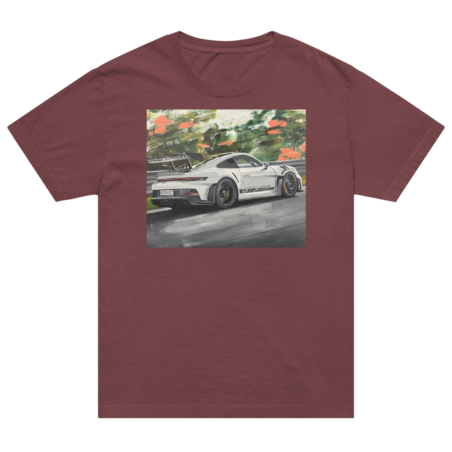 A heathered maroon crewneck t-shirt featuring a square graphic print of a white sports car on a racetrack with green trees in the background. Daniel Maltzman artist.