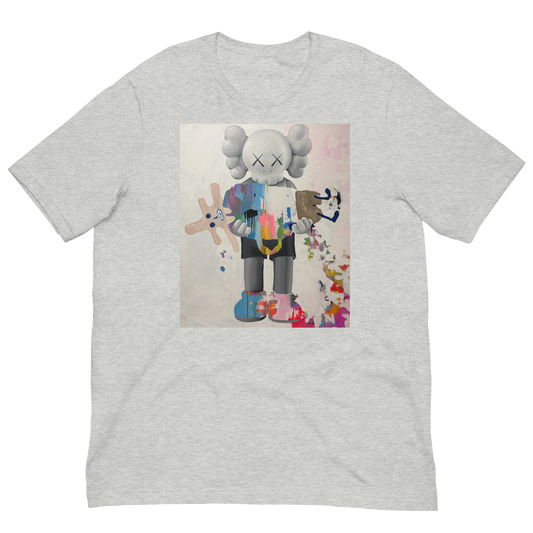 A light heather gray crewneck t-shirt featuring a central graphic print of a stylized cartoon character resembling KAWS, holding a pink plush toy, displayed on a solid white background. Daniel Maltzman artist. 