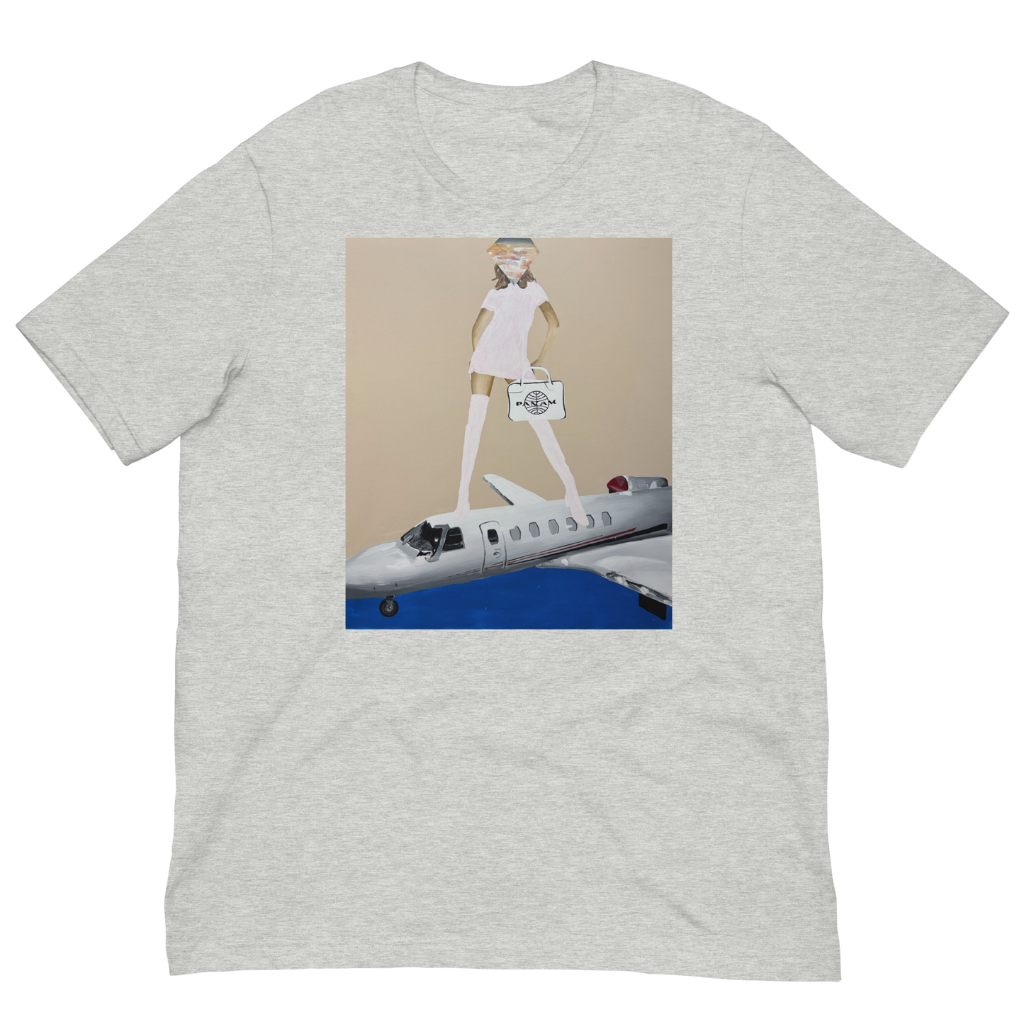 A light heather gray short-sleeve t-shirt with a central graphic print. The print features a cartoon illustration of a woman in a white dress and hat walking on top of a white and blue private jet against a beige background. Daniel Maltzman artist.