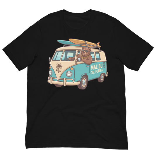A black short-sleeve crewneck t-shirt featuring a colorful graphic of a retro-style teal and beige van with a cartoon bear driving it, carrying surfboards on top, and 'MALIBU CALIFORNIA' printed on the side.