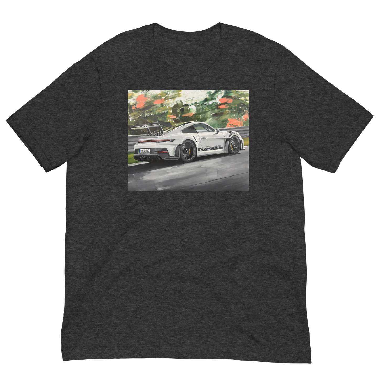 A dark heather gray short-sleeve t-shirt with a rectangular graphic print on the chest showing a white sports car on a racetrack with green trees in the background. Daniel Maltzman original desgn.