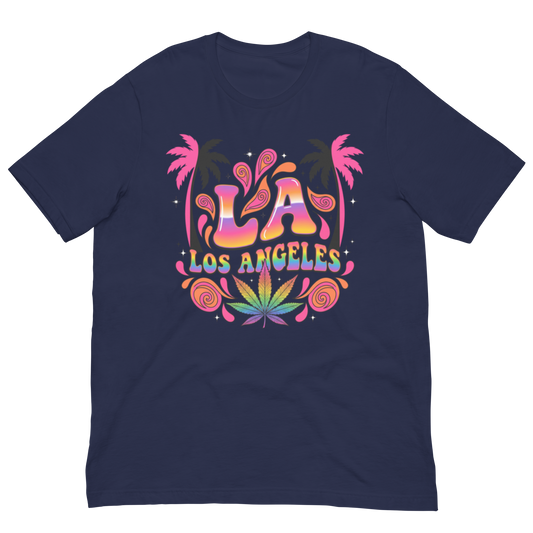 A navy blue short-sleeve t-shirt with a colorful retro graphic on the chest featuring the text 'LA LOS ANGELES' in a rainbow gradient, flanked by pink palm trees and a green cannabis leaf design.